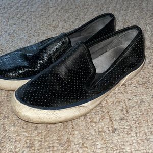 Black sperry slip on shoes.